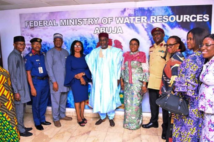 The Honorable Minister of Water Resources Engr Suleiman Adamu, flanked by the Permanent Secretary Mrs Didi Walson-Jack mni and some members of the planning committee who attended the inauguration physically. Other members joined virtually through zoom