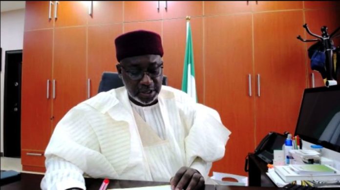 The Honorable Minister of Water Resources Engr Suleiman H Adamu delivering his Keynote address during the NINCID meeting Via Zoom