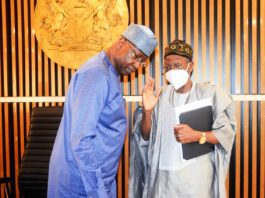 SGF, Boss Mustapha while conversing with Honourable Minister of Information & Culture, Alhaji Lai Mohammed during the inauguration of Inter-Ministerial Committee on 2022 Democracy Day celebration in his office