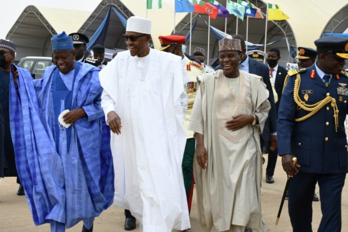 DSC_9601 President Muhammadu Buhari (2nd Left), Governor of Kano State, Abdullahi Ganduje(L), Minister of Defence Maj Gen Bashir Salihi Magashi (2nd Right) and Chief of Air Staff, Air Marshal Oladayo Amao (R) at the Nigerian Air Force at 58 Celebration in Kano.