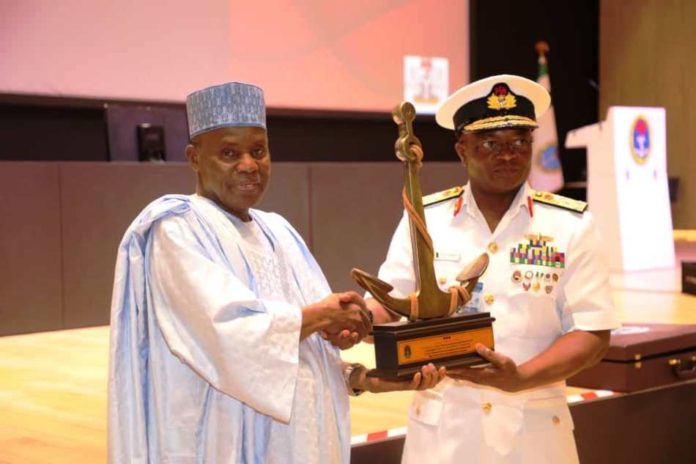 L-R - Maj Gen Bashir Salihi Magashi receiving accollade from the Chief of Naval Staff, Vice Admiral AZ Gambo