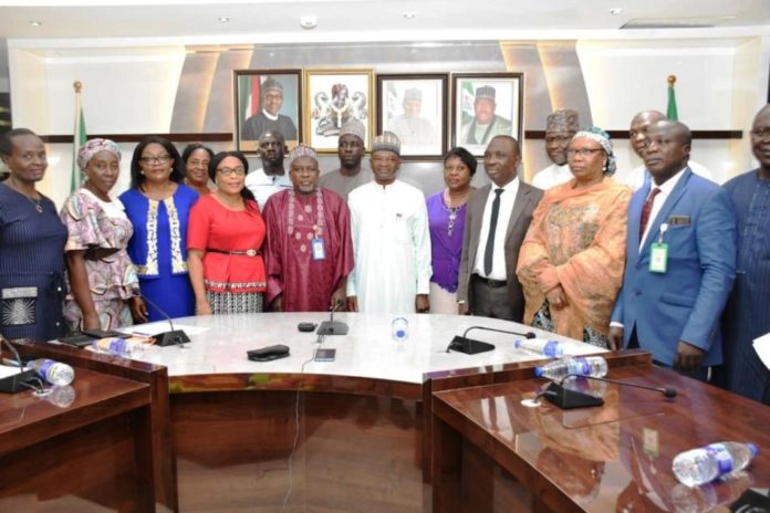 LEATHER 1 he Minister of Agriculture and Rural Development, Dr. Mohammad Mahmood Abubakar (C), on the right hand side of the Minister, Chairman of the Committee Prof. Mohammed Kabir Yakubu and others in a Group Photograph during the Meeting
