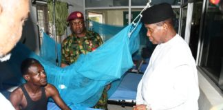 he Minister of Defence, Maj Gen Bashir Salihi Magashi (rtd) interacting with a patient at the Armed Forces Specialist hospital, Kano.