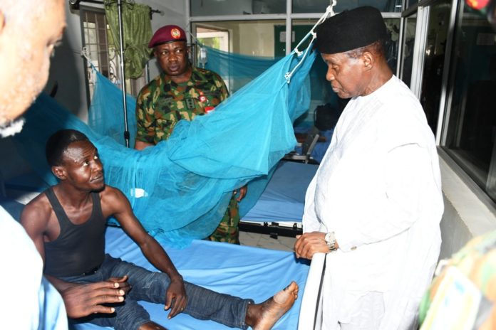 Maj Gen Bashir Salihi Magashi (rtd) interacting with a patient he Minister of Defence, Maj Gen Bashir Salihi Magashi (rtd) interacting with a patient at the Armed Forces Specialist hospital, Kano.