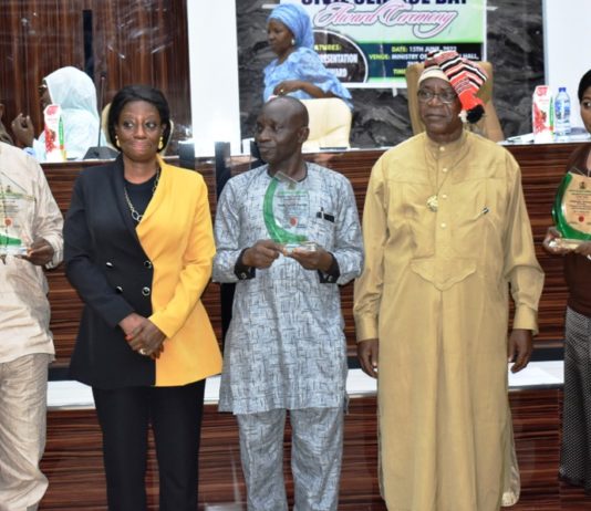 L-R: Adams Danladi (Assistant Director, Procurement), A: Presidential Distinguished Public Service Career Award (PDPSCA), Mrs. Edenmaya Ibilola Brayila, (Director General Services); Fanoiki Sunday (Chief Administrative Officer), B: Presidential Merit Award, (PMA), Mr. Iche Kalu Anya, (Director Human Resource Management) and Representative of Mrs. Akinola Yetunde (Clerical Officer) C: (Head of Service Commendation Letter (HOSCL) during the Ministry’s 2022 Civil Service Commemoration and Ministerial Award at the Ministry’s headquarters in Abuja.