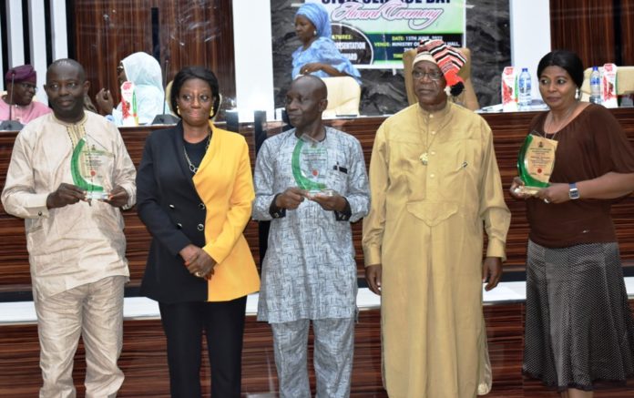 Ministry’s 2022 Civil Service Commemoration L-R: Adams Danladi (Assistant Director, Procurement), A: Presidential Distinguished Public Service Career Award (PDPSCA), Mrs. Edenmaya Ibilola Brayila, (Director General Services); Fanoiki Sunday (Chief Administrative Officer), B: Presidential Merit Award, (PMA), Mr. Iche Kalu Anya, (Director Human Resource Management) and Representative of Mrs. Akinola Yetunde (Clerical Officer) C: (Head of Service Commendation Letter (HOSCL) during the Ministry’s 2022 Civil Service Commemoration and Ministerial Award at the Ministry’s headquarters in Abuja.