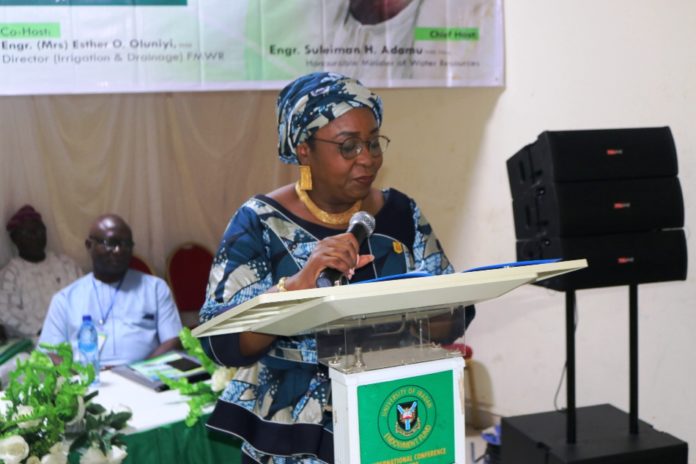 Permanent Secretary Federal Ministry of Water Resources Mrs Didi Walson-Jack mni he Permanent Secretary Federal Ministry of Water Resources Mrs Didi Walson-Jack mni and Representative of the Honourable Minister, reading the keynote address at the WUA Workshop