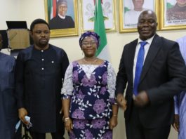 Permanent Secretary of the Ministry, Dr. Evelyn Ngige (centre), flanked to the right by the in-coming Executive Director, Sir. Charles Onyeka Okoye and to her left by the out-going Ag. Executive Director of Lagos International Trade Fair Complex, Mr. Francis Dajilek during the formal handing over ceremony in her Office, Abuja