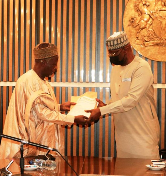 SGF, Boss Mustapha (R) while receiving report from Chairman, Katsina State Elders' Forum , Senator Abba Ali, in his office
