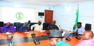 The SGoF, Surv. Adebomehin explaining certain salient areas on a projected Nigeria Administrative Map to the RMAFC team