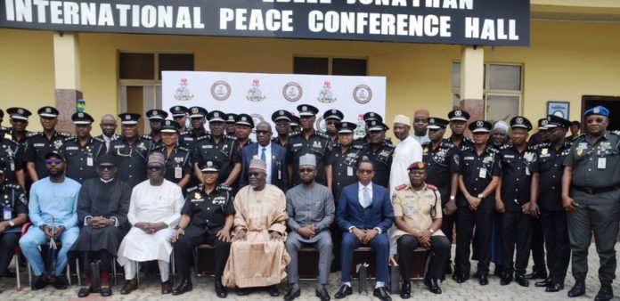 launch of Police Specialized Services Automation Project 2nd L-R Chief Executive Officer, (POSSAP Solutions Ltd), Dr. David Ibhawoh , Chairman, Mohammed Ciroma; Inspector General of Police, IGP Alkali Baba Usman; Minister of Police Affairs, Dr. Mohammad Maigari Dingyadi, Permanent Secretary; Temitope Fashedemi and Police Management team/AIGs from Zones during the launch of Police Specialized Services Automation Project (POSSAP) at the International Peace Conference Hall, Nigeria Police Force Headquarters in Abuja