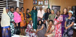Permanent Secretary, Federal Ministry of Labour and Employment, Ms Kachollom S. Daju, mni (meddle); President, Women Inspired Initiative, Loyce Ogueri (6th left) and other members of Women Inspired Initiative of the Ministry, during their visit to the Permanent Secretary, in Abuja