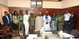 Minister of Defence, Maj Gen Bashir Salihi Magashi Rtd (M), Permanent Secretary, Ministry of Defence, Dr Ibrahim Abubakar Kana mni (5th L) and inaugurated DICON Committee in a group picture at Ship House, Abuja