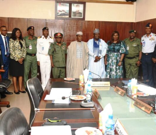 Minister of Defence, Maj Gen Bashir Salihi Magashi Rtd (M), Permanent Secretary, Ministry of Defence, Dr Ibrahim Abubakar Kana mni (5th L) and inaugurated DICON Committee in a group picture at Ship House, Abuja