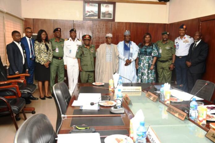 DICON Committee Minister of Defence, Maj Gen Bashir Salihi Magashi Rtd (M), Permanent Secretary, Ministry of Defence, Dr Ibrahim Abubakar Kana mni (5th L) and inaugurated DICON Committee in a group picture at Ship House, Abuja