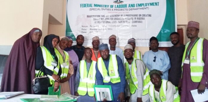 FG BRIDGES SKILLS GAPS Representative of Hon. Minister of Labour and Employment, Ismaila Abubakar (5th right back); Head of the Training Institute, Idris Abubakar Saddiq (6th right back) with the trainees, in Gusau, Zamfara State