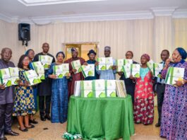 (5th Right) The Representative of the Permanent Secretary, Federal Ministry of Humanitarian Affairs, Disaster Management and Social) Development, Dr. Nasir Sani Gwarzo, Director Humanitarian Affairs, Grema Ali Alhaji, (5th Left) Director Special Needs, Nkechi Onwukwe, (2nd Right) the Representative of the Minister of Science and Technology, Director Policy Analysis, Statistics and International Relations, Igili Andrew, (6th Right) the Representative of the Executive Secretary National Commision for Persons with Disabilities (NCPWD), Acting Director Social Integration (NCPWD), Lawrence Idemudia, Dr. Sunday Udo Country Director leprosy Mission Nigeria, (1st Left) Director Legal, Garba Haganawega, (3rd Left) Daughters of Charity St. Vicenteo Paul, Sister Fidelia Unigw, (3rd Right) Deputy Director Social Welfare SDS (FCTA) Beatrice Pwajok, and others during the Presentation of the National Roadmap on the Production of Local Assistive Technologies for PWDs in Nigeria, on 19th August, 2022. In Abuja