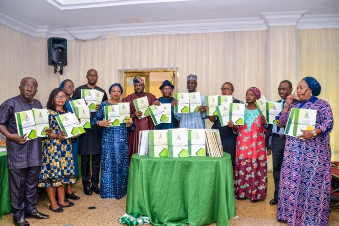 ROAD MAP PWD 1 (5th Right) The Representative of the Permanent Secretary, Federal Ministry of Humanitarian Affairs, Disaster Management and Social) Development, Dr. Nasir Sani Gwarzo, Director Humanitarian Affairs, Grema Ali Alhaji, (5th Left) Director Special Needs, Nkechi Onwukwe, (2nd Right) the Representative of the Minister of Science and Technology, Director Policy Analysis, Statistics and International Relations, Igili Andrew, (6th Right) the Representative of the Executive Secretary National Commision for Persons with Disabilities (NCPWD), Acting Director Social Integration (NCPWD), Lawrence Idemudia, Dr. Sunday Udo Country Director leprosy Mission Nigeria, (1st Left) Director Legal, Garba Haganawega, (3rd Left) Daughters of Charity St. Vicenteo Paul, Sister Fidelia Unigw, (3rd Right) Deputy Director Social Welfare SDS (FCTA) Beatrice Pwajok, and others during the Presentation of the National Roadmap on the Production of Local Assistive Technologies for PWDs in Nigeria, on 19th August, 2022. In Abuja