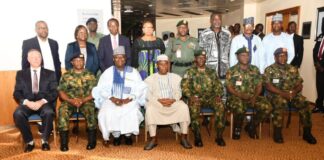 The Minister of Defence, Maj Gen Bashir Salihi Magashi (Rtd) (M), the Permanent Secretary, Dr Abubakar Kana, mni (3rd L) with the Chief of Defence Staff, Gen Lucky Irabor(3rd R) with the Service Chiefs and other stakeholders in a group photograph at the workshop in Transcorp Hilton Hotel, Abuja