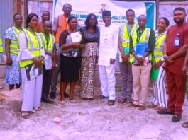 Representative of the Honourable Minister, Olajide Oshundun (6th right); Kogi State Labour Controller, Mrs Oluwatoyin Olugbami (7th right), with some of the participants at one of the training sites (fish farm) - Lokoja