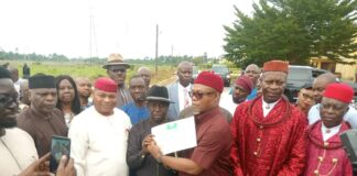 Special Guest of Honour ., Senator Mpigi Barinada, (right) presenting the Handover Certificate to the provost of the College, Dr Emmanuel Ikenyiri( middle) , Ag Perm Secretary, Dr Famous Eseduwo (3rd left), Director, Drought , Dersertification and Coastal Management Department, Alhaji Haruna Bello(2nd right) .