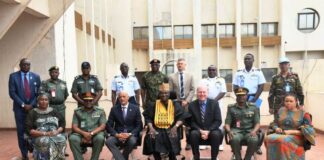 The representative of the Minister of Defence, Maj Gen Bashir Salihi Magashi, Dr. Abubakar Ibrahim Kana, mni (M) with the delegation of the United Nations Peacekeeping Strategic Partnership led by Major General Jai Menon (Rtd) (3rd L) and some staff of Ministry of Defence at Ship House, Abuja.