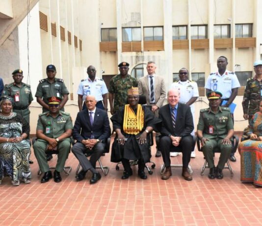 The representative of the Minister of Defence, Maj Gen Bashir Salihi Magashi, Dr. Abubakar Ibrahim Kana, mni (M) with the delegation of the United Nations Peacekeeping Strategic Partnership led by Major General Jai Menon (Rtd) (3rd L) and some staff of Ministry of Defence at Ship House, Abuja.
