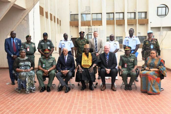 United Nations Peacekeeping Strategic Partnership The representative of the Minister of Defence, Maj Gen Bashir Salihi Magashi, Dr. Abubakar Ibrahim Kana, mni (M) with the delegation of the United Nations Peacekeeping Strategic Partnership led by Major General Jai Menon (Rtd) (3rd L) and some staff of Ministry of Defence at Ship House, Abuja.