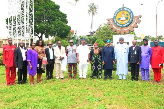 group photograph during the Official Visit Hon. Minister of Science, Technology and Innovation, Dr. (Sen.) Adeleke Olorunnimbe Mamora (5th right), Director Chemical Technology Department, Federal Ministry of Science, Technology and Innovation, Mr. M.E.J BASSEY (4th right), Director-General, Federal Institute of Industrial Research Oshodi (FIIRO), Dr. (Mrs) Jummai Tutuwa Adamu (6th right), representative of FIIRO Board Chairman, Hon. Ajayi Nichoas (7th right), Director Finance and Account FIIRO, Mr. Oderinde Joshua Okeowo (3rd right), Director Chemical, Fibre and Environmental Technology Department FIIRO, Dr. Chima Igwe (2nd right), Director Biotechnology FIIRO, Dr. Lawal Kolawole (6th left), Director Planning FIIRO, Dr. (Mrs.) Bolanle Oyedoyin (3rd left), and Mr. Edike Ike Adoh-Ogbuta FIIRO Board Member (7th left), Deputy Director Press and Public Relation, Federal Ministry of Science, Technology and Innovation, Mr. Atuora O. Obed (left), and other Management Staff of FIIRO in a group photograph during the Official Visit of the Hon. Minister to the Institute today in Lagos