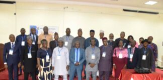 Director overseeing the Office of the Permanent Secretary, MPR, (4th left) & Director Gas, MPR, (3rd left) in a group photograph with participants at the event.