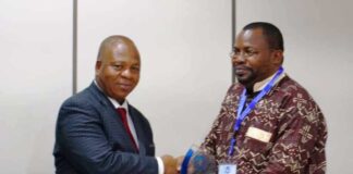 SGF, Boss Mustapha, represented by PS, GSO, Dr. Nnamdi Mbaeri (L) while receiving a plaque on behalf of the SGF when the latter paid him a courtesy visit