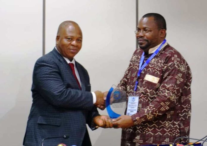 SGF, Boss Mustapha, represented by PS, GSO, Dr. Nnamdi Mbaeri (L) while receiving a plaque on behalf of the SGF when the latter paid him a courtesy visit SGF, Boss Mustapha, represented by PS, GSO, Dr. Nnamdi Mbaeri (L) while receiving a plaque on behalf of the SGF when the latter paid him a courtesy visit