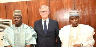 Group photograph of the Minister of Defence, Maj Gen. Bashir Salihi Magashi (M), The Permanent Secretary, MOD, Dr. Ibrahim Abubakar Kana mni (3rd L), the United Nations Under Secretary General for Peace Operations, Mr. Jean-Pierre Lacroix (4th L) and some management staff of MOD and UN aides on a working visit to Ship House, Abuja