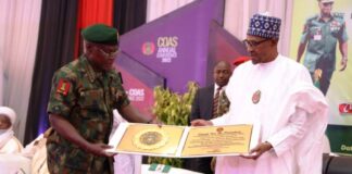 President Muhammadu Buhari Receiving a Plague from Chief of Army Staff, Lt Gen Farouk Yahaya.