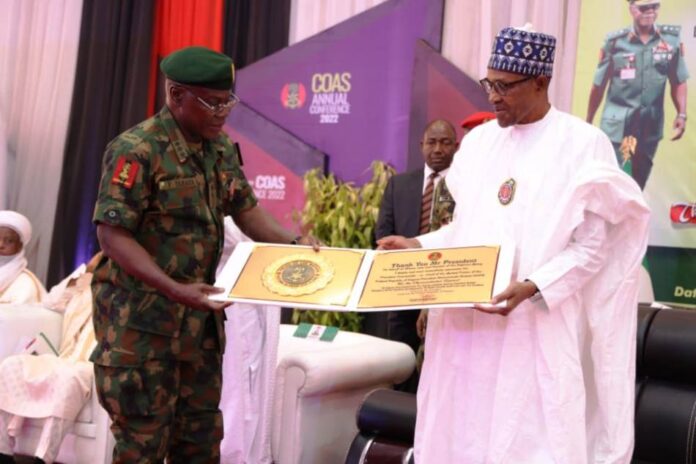 President Muhammadu Buhari Receiving a Plague from Chief of Army Staff, Lt Gen Farouk Yahaya.