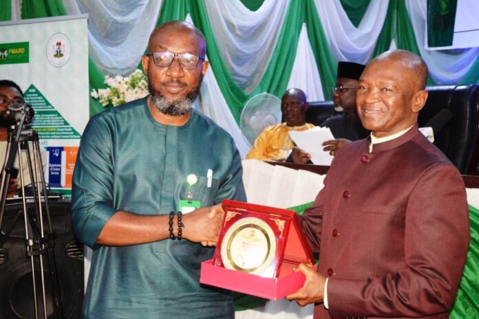 Mr. Ezeaja Ikemefuna, Assistant Director, Information Department Mr. Ezeaja Ikemefuna, Assistant Director, Information Department, receiving Ministerial Services Award from the Hon. Minister of Agriculture and Rural Development, Dr. Mohammad Mahmood Abubakar in Abuja recently.