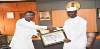 Picture of the Hon. Minister of State (BNP) been presented with Certificate of Commendation by Coalition of Transparency Observer Group (CTOG) in Abuja.