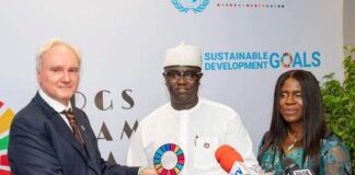 THE MINISTER OF STATE, PRINCE CLEM IKANADE AGBA FLANKED TO THE LEFT WITH THE UN RESIDENT CORDINATOR, MATTHIAS SCHMALE AND ON THE RIGHT HIS WIFE PRINCESS CATHERINE AGBA DURING THE PRESENTATION OF AWARD