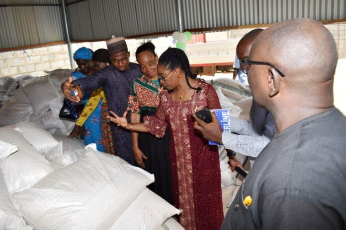The Director, Animal Husbandry Services The Director, Animal Husbandry Services, Mrs Winnie Lai Solorin, inspecting Animal Feed at the Workshop.