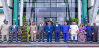 Picture of the Governor of Enugu State (middle) the Permanent Secretary Budget and National Planning (left) Enugu SSG (right) and other team members of PS entourage.