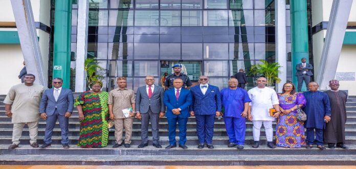 CASSAVA BIO-ECONOMY TO PROMOTE SUSTAINABLE ECONOMIC GROWTH IN NIGERIA. Picture of the Governor of Enugu State (middle) the Permanent Secretary Budget and National Planning (left) Enugu SSG (right) and other team members of PS entourage.