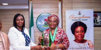 Head of the Civil Service of the Federation, Dr. Folasade Yemi-Esan, Receiving the plaque from the PS, Federal Ministry of Labour and Employement, Ms Kachallom Daju mni, during the National Productivity order of Merit Award (MPOM) Confered on the Head of the Civil service of the Federation, in Abuja.
