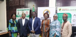 Ag. Managing Director/CEO, FERMA, Engr. Godson Chimezie Amos, FNSE, FNIHTE (middle) with some Directors of the Agency and the Consultants in a group photograph during the inauguration