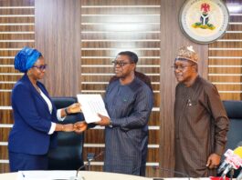Left:The Permanent Secretary, Ministry of Mines and Steel Development, Dr. Mary A. Ogbe; receiving the geological data from Engr. Sellim Salaam,Project Coordinator MinDiver: Right is the Director General Nigerian Geological Survey Agency, (NGSA), Dr. Abdulrazaq A. Garba during the Hand Over of High Resolution Airborne Geophysical Survey Data of Southwestern Block to Nigerian Geological Survey Agency, held recently at the Ministry's Headquarters, Abuja