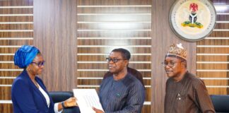 Left:The Permanent Secretary, Ministry of Mines and Steel Development, Dr. Mary A. Ogbe; receiving the geological data from Engr. Sellim Salaam,Project Coordinator MinDiver: Right is the Director General Nigerian Geological Survey Agency, (NGSA), Dr. Abdulrazaq A. Garba during the Hand Over of High Resolution Airborne Geophysical Survey Data of Southwestern Block to Nigerian Geological Survey Agency, held recently at the Ministry's Headquarters, Abuja