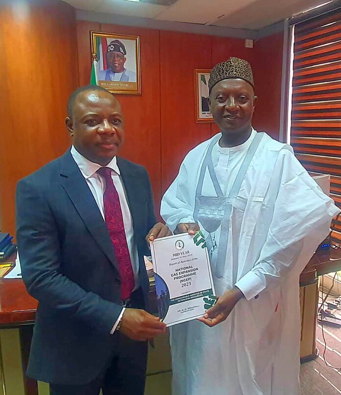 Permanent Secretary, Amb. Gabriel Tanimu Aduda Receiving the Report from Dr. MM Ibrahim