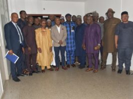 Permanent Secretary MPR, Amb. Gabriel T. Aduda (c), flanked by Director Upstream (MPR) Engr. Kamoru Busari (5th right), Prof. I.A. Mohammed Dabo (3rd left) and other members of the committee in a group photograph to mark the end of the inauguration ceremony.