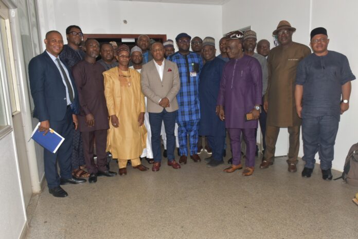 Permanent Secretary MPR, Amb. Gabriel T. Aduda (c), flanked by Director Upstream (MPR) Engr. Kamoru Busari (5th right), Prof. I.A. Mohammed Dabo (3rd left) and other members of the committee in a group photograph to mark the end of the inauguration ceremony. Permanent Secretary MPR, Amb. Gabriel T. Aduda (c), flanked by Director Upstream (MPR) Engr. Kamoru Busari (5th right), Prof. I.A. Mohammed Dabo (3rd left) and other members of the committee in a group photograph to mark the end of the inauguration ceremony.