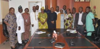 The Permanent Secretary (MPR) Amb. Gabriel T. Aduda (c) flanked by Director of HRM, Mrs. Asma'u Shehu (r) and Director of Internal Audit, Mrs. Warren B. Augusta (L) in a group photograph with some of the Ministry's Performance Management System Champions to mark the end of the ceremony.
