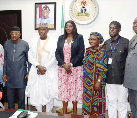Permanent Secretary, Federal Ministry of Labour and Employment, Kachollom Daju, mni (meedle); Director, Occupational Safety and Health, Loretta Adogu (3rd right) with the newly Inaugurated committee members, Abuja